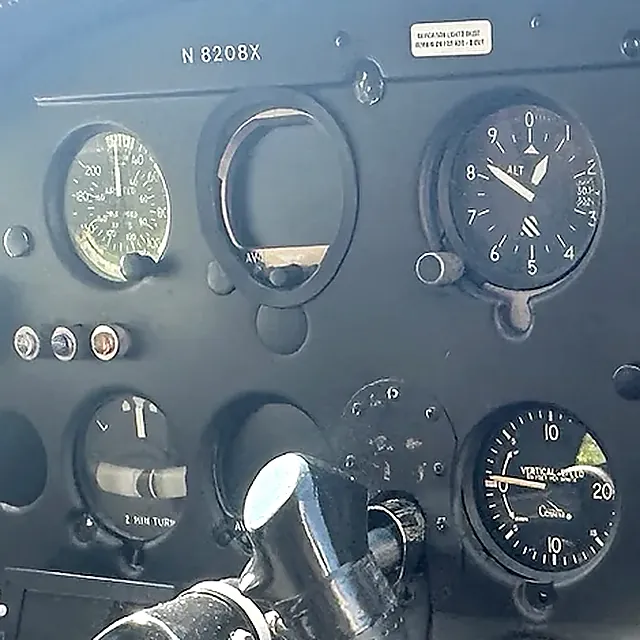 Close-up of the instrument panel of N8208X, the 1961 Cessna 172B you'll fly, with the tail number stamped above the flight instruments.