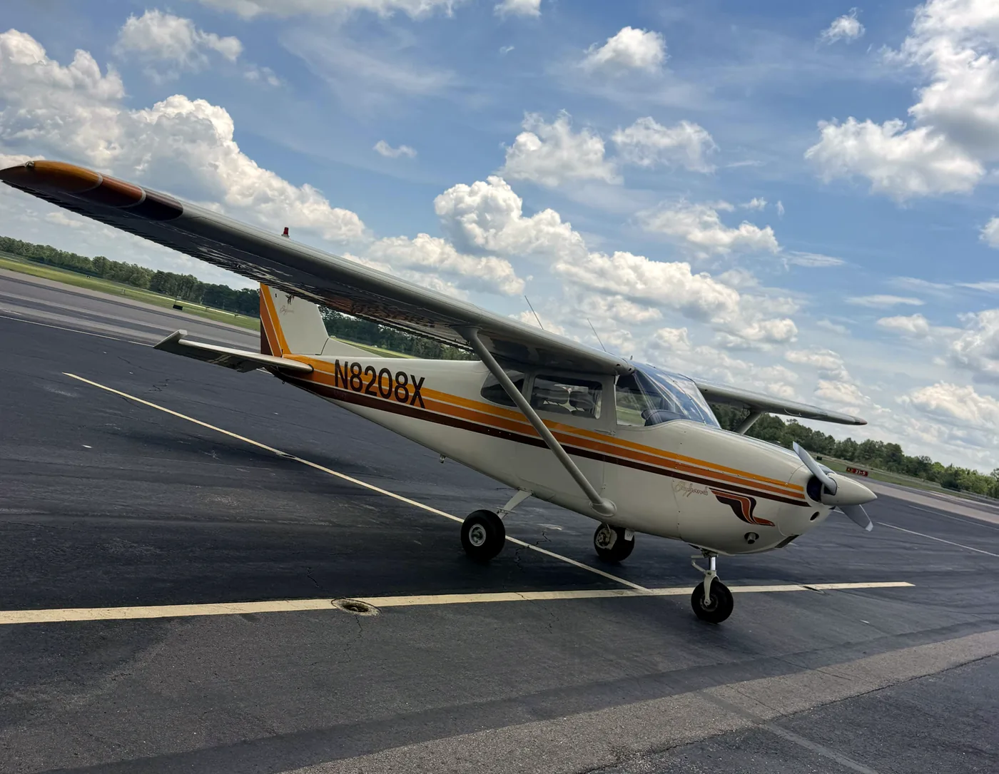N8208X, the 1961 Cessna 172B, parked on the ramp with its tail number visible.