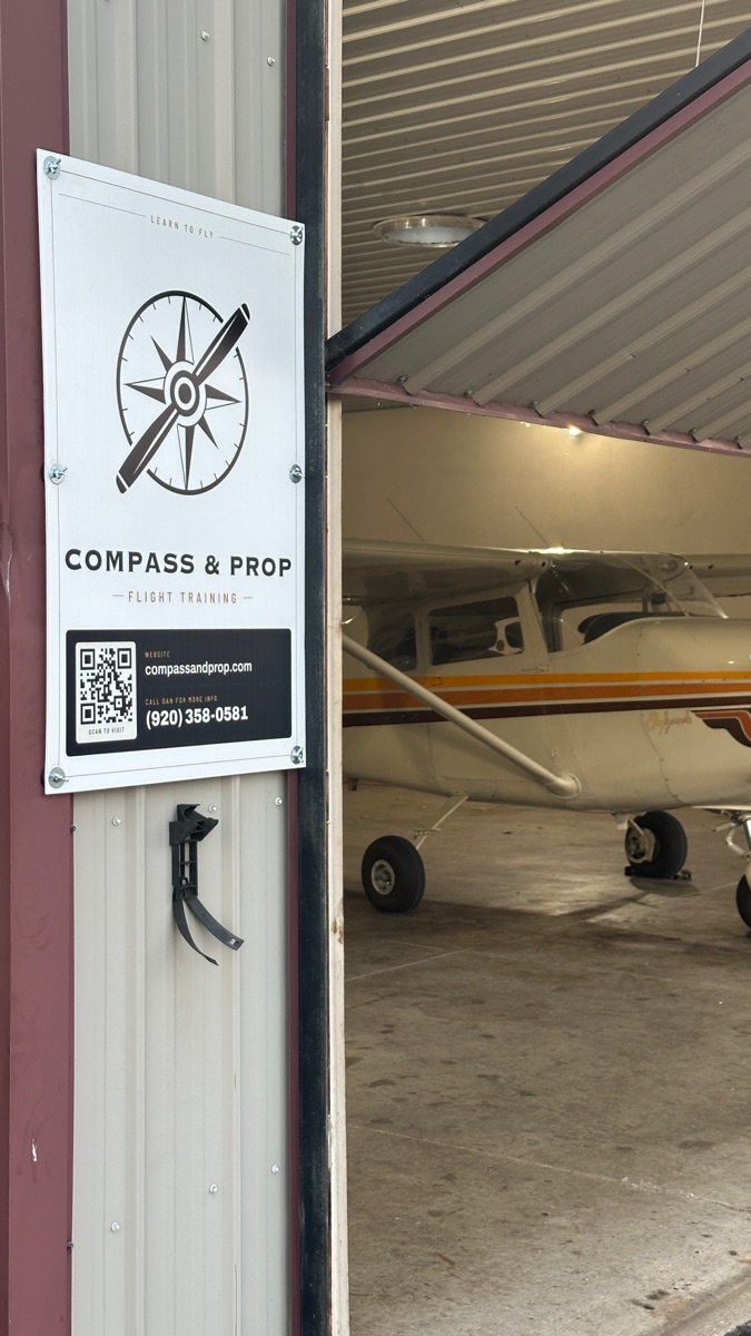 The new Compass and Prop sign at the hangar at Brennand Airport
