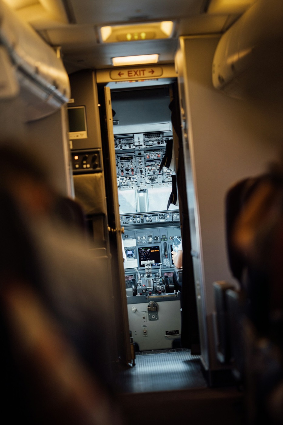 Looking forward through a light aircraft cockpit at the instrument panel.